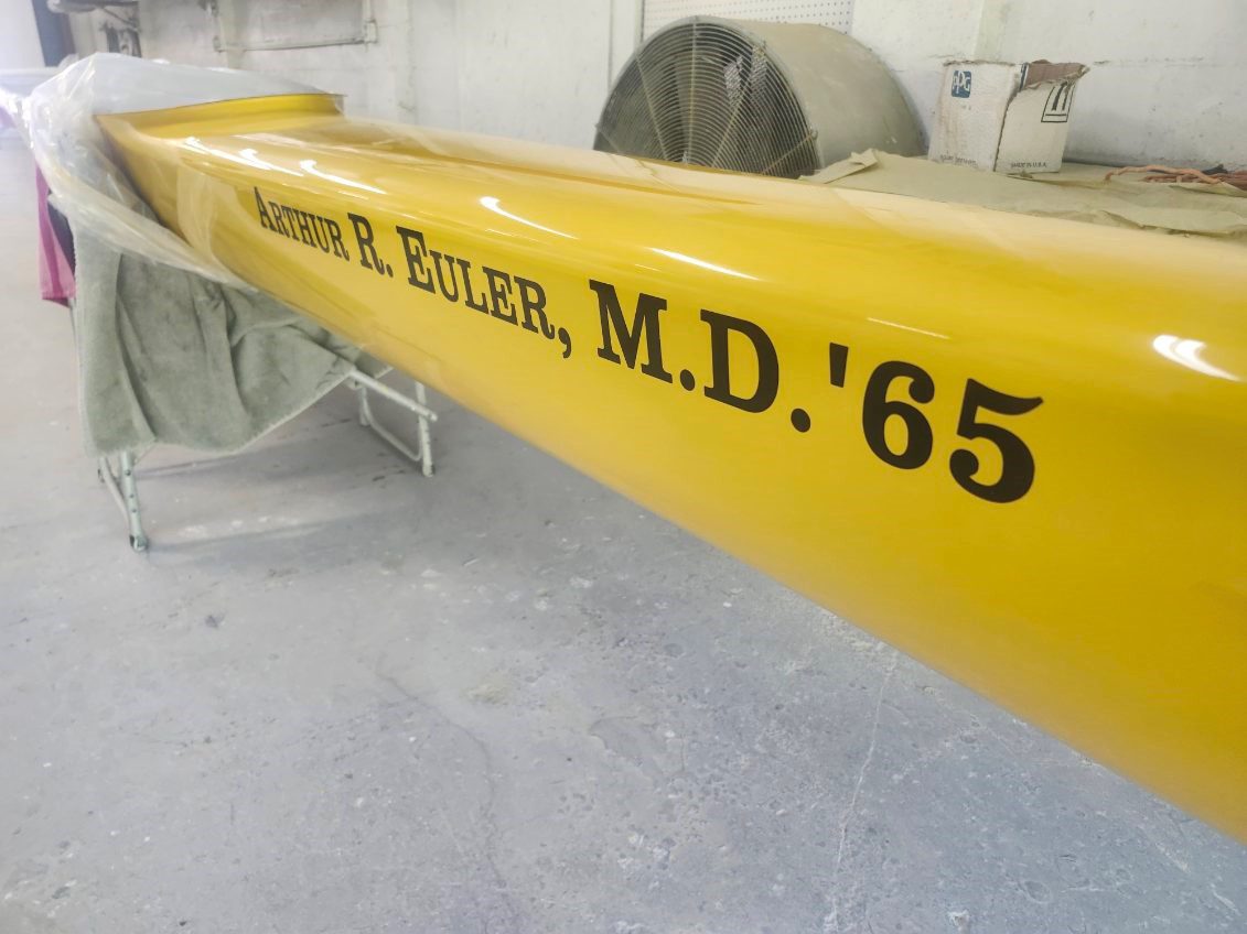 Close-up of a yellow object labeled with a doctor's name and graduation year.