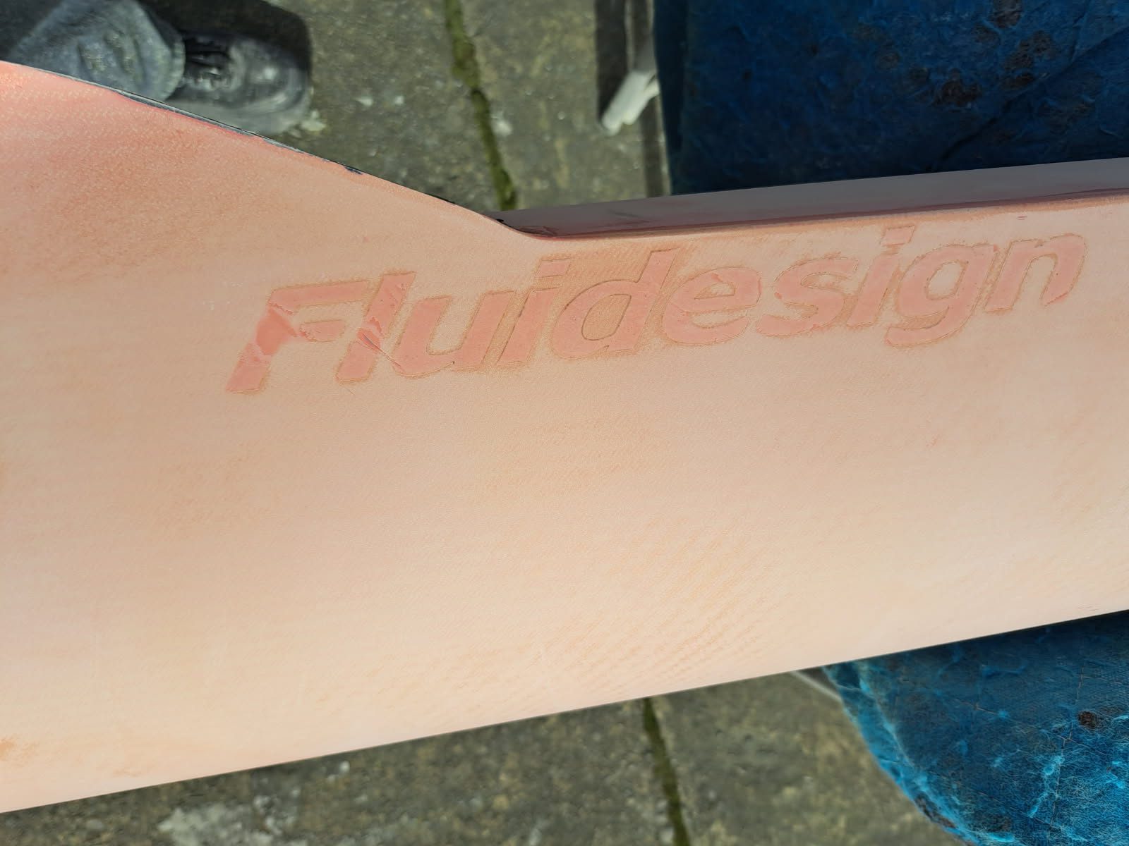 Close-up of a Fluval aquarium filter label on a beige surface.