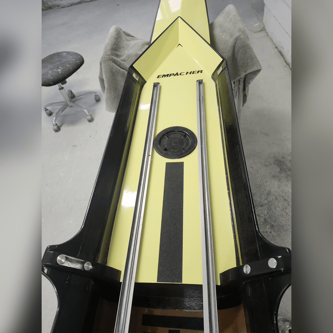 Close-up of a unique stringed musical instrument with a triangular body.