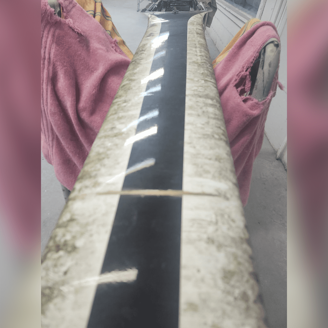 Close-up of a guitar neck with frets and strings.